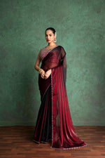 Red saree with a sequin blouse, styled with statement jewelry maroon saree with a sequin blouse, styled with statement jewelry