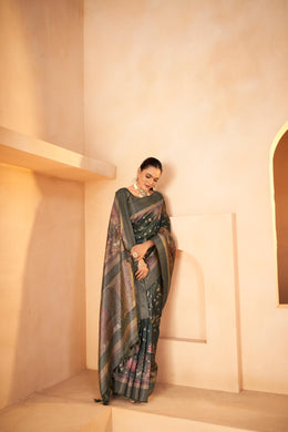 Green silk Saree is worn by a women with different textures on the saree and Jacquard palu
