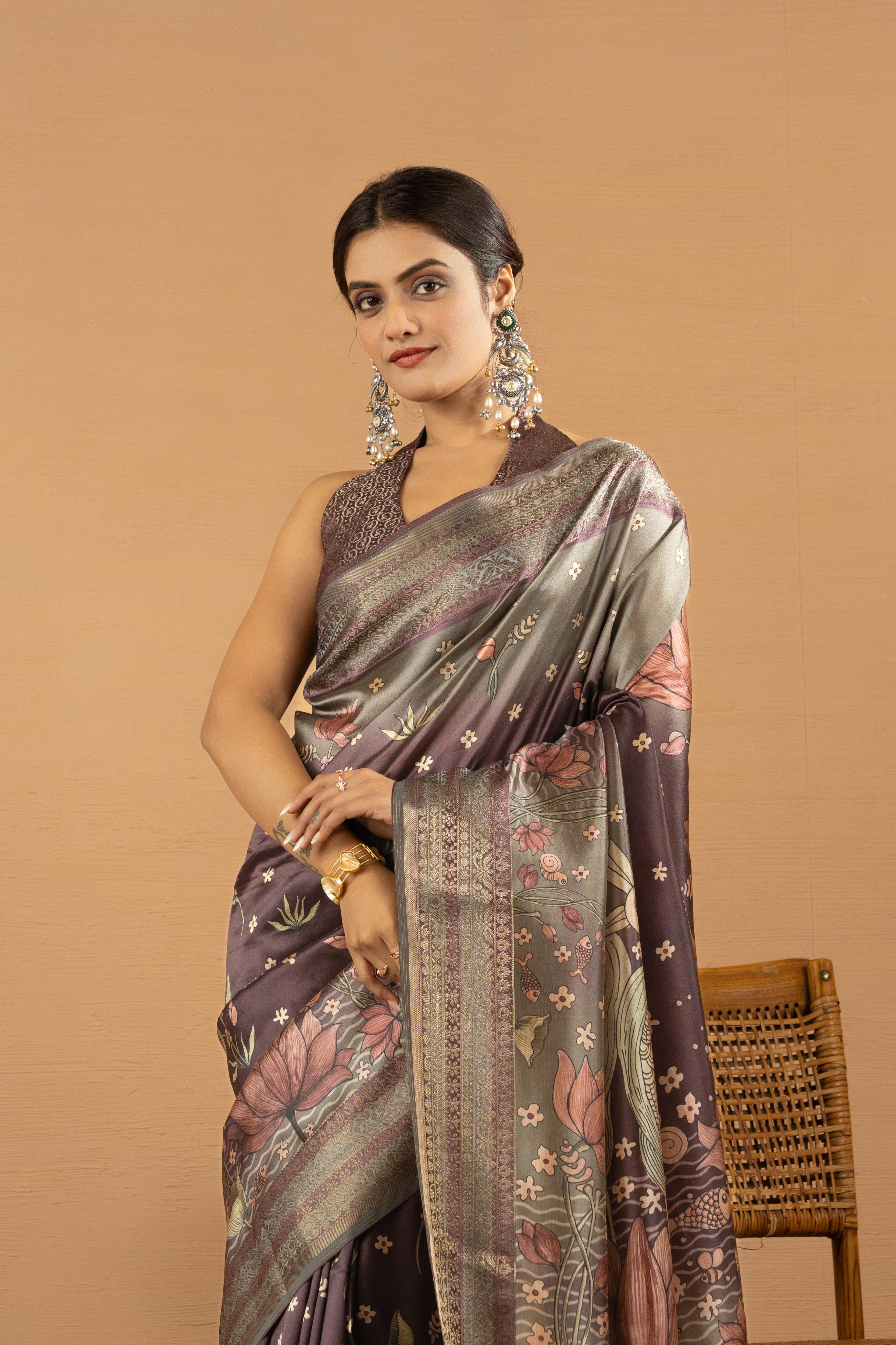 Wine colour silk saree with flowers and floral print is wore by a women