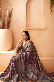 Women wearing a Wine Colour Silk Saree with Jacquard palu and birds and lotus is made 