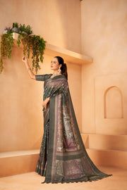 Green Saree with Silk fabric and Jacquard border is worn by a women 